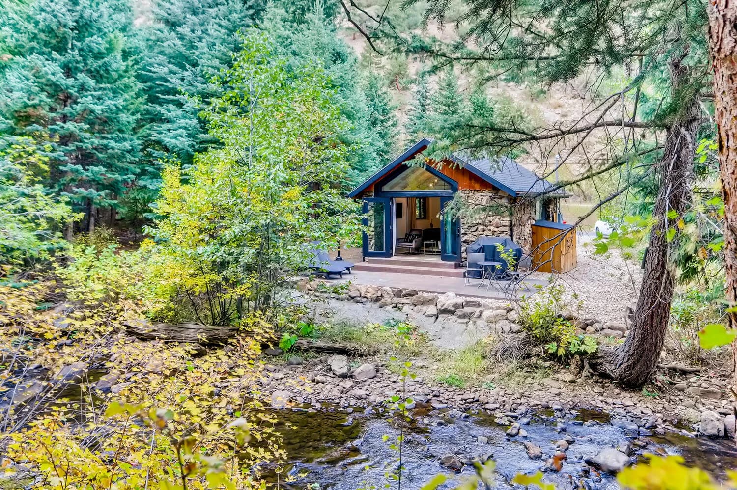 A stone cabin beside Chicago Creek at Water and Stone